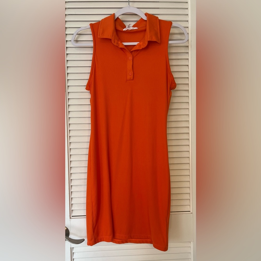 Orange mini polo dress.